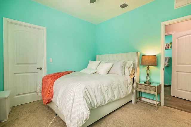 a front view of a house with yard and green space