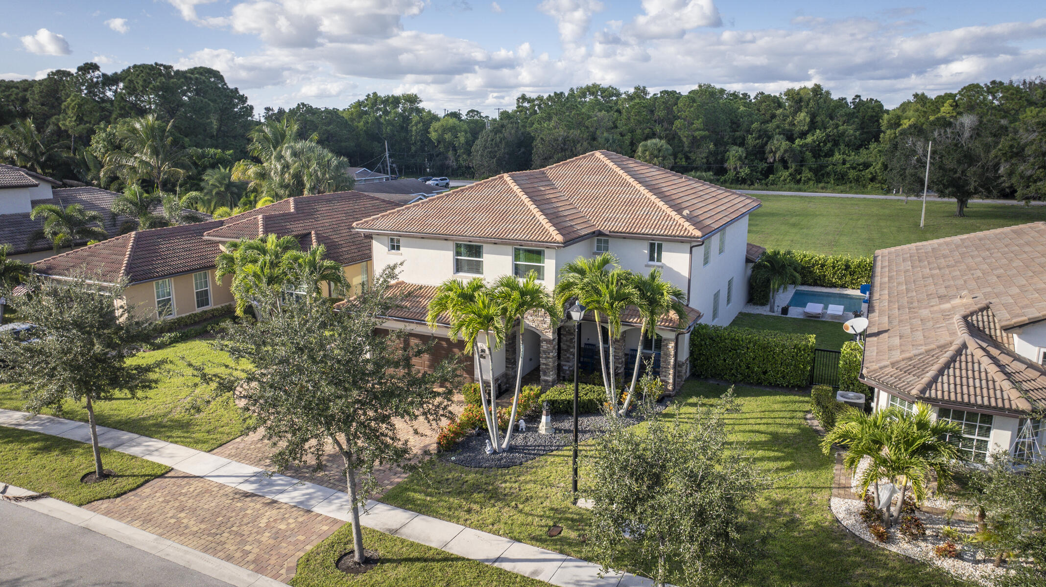 7131 Limestone Cay Road Limestone Creek, FL 33458 - Photo 56 of 65 a front view of a house with a yard