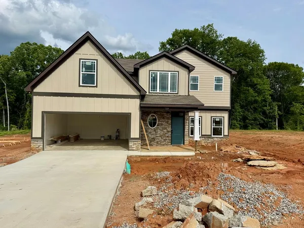 a front view of a house with yard
