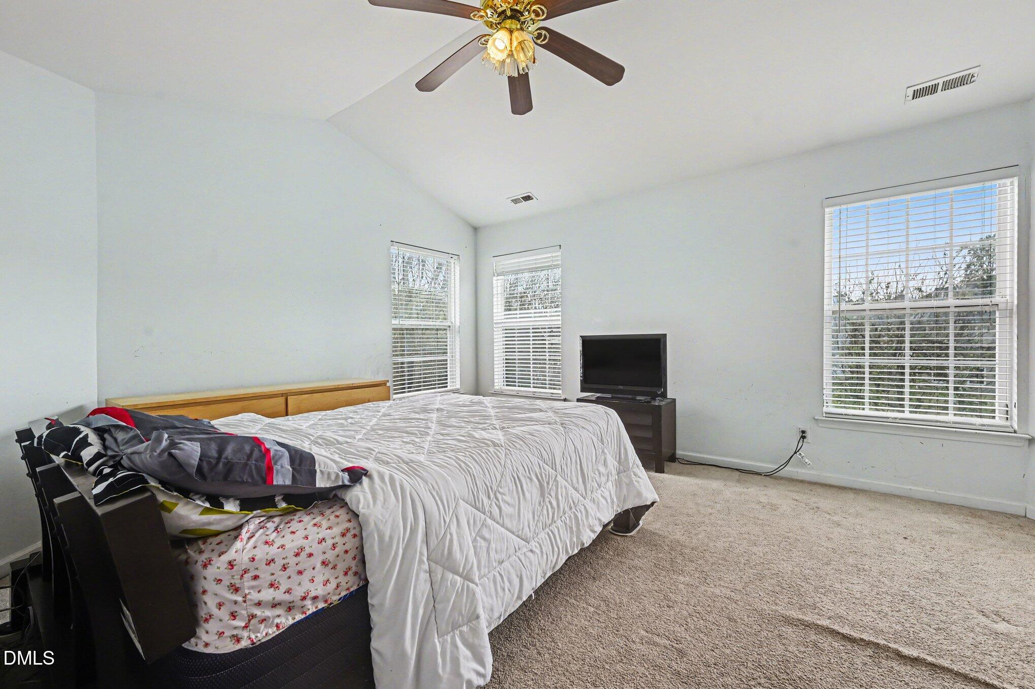 5115 Cardinal Grove Boulevard Raleigh, NC 27616 - Photo 19 of 36 a bedroom with a bed and window