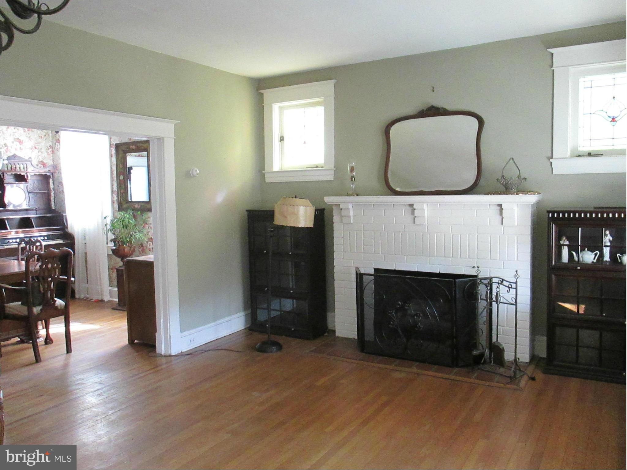 203 Mallow Hill Road Baltimore, MD 21229 - Photo 2 of 30 Gracious Living room with stained glass windows