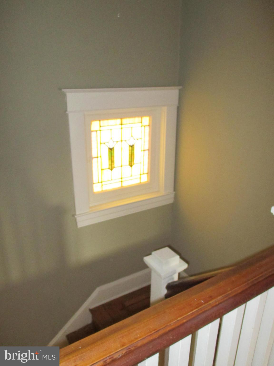 203 Mallow Hill Road Baltimore, MD 21229 - Photo 19 of 30 Wide Staircase with stained Glass window
