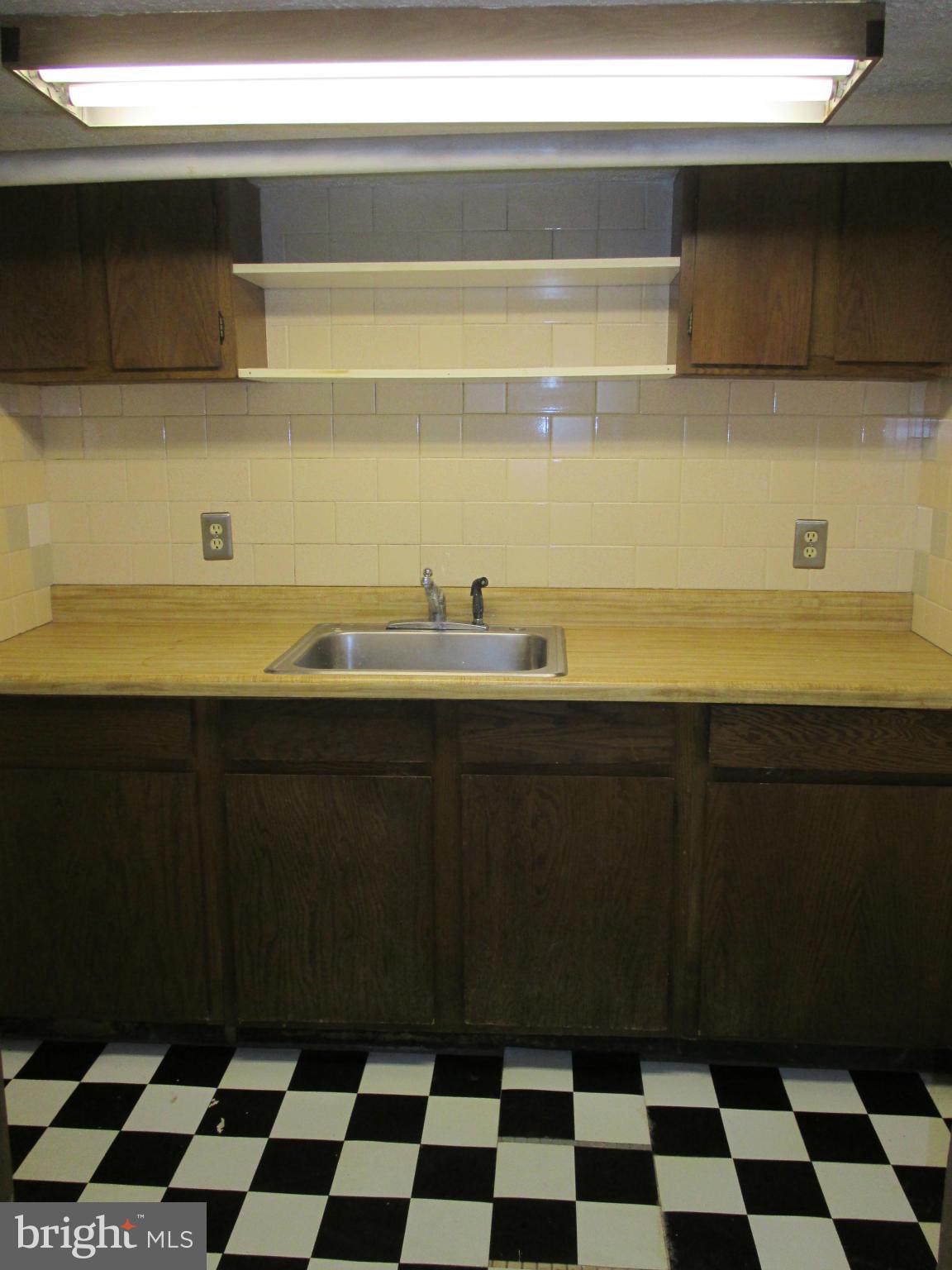 203 Mallow Hill Road Baltimore, MD 21229 - Photo 26 of 30 Basement with kitchenette, sink