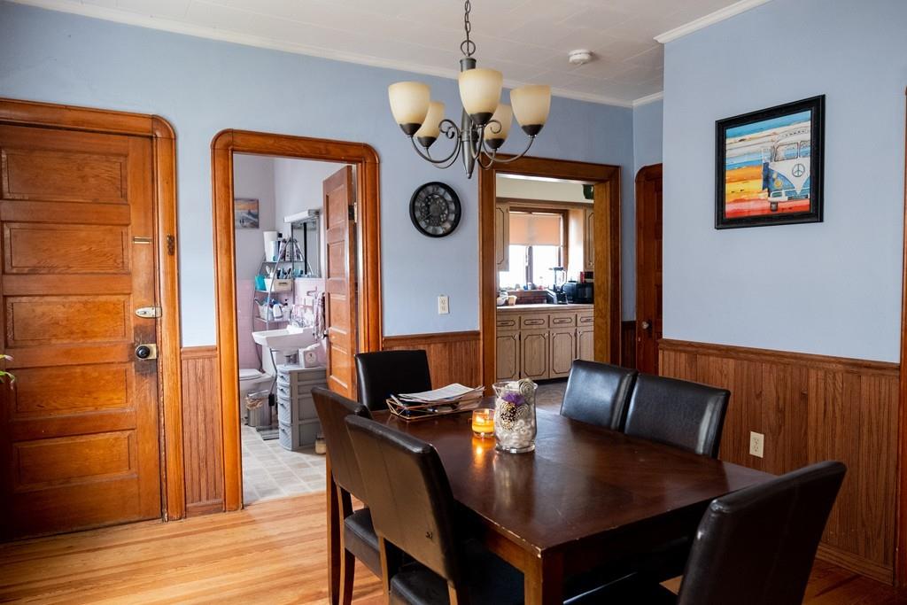97 Stevens Street Fall River, MA 02721 - Photo 14 of 20 a view of a dining room with furniture and wooden floor