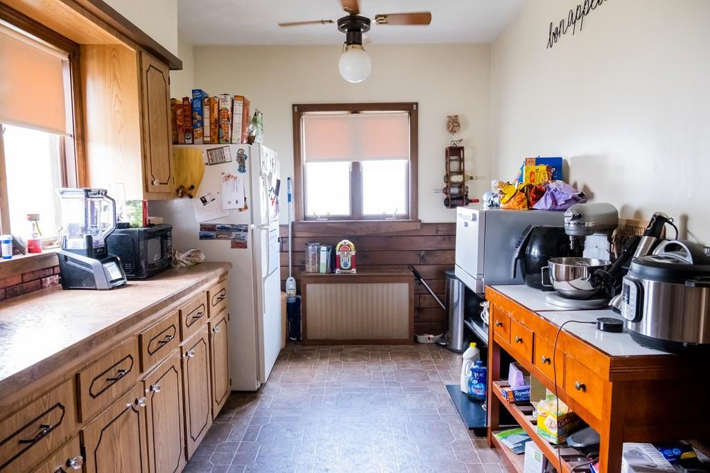 97 Stevens Street Fall River, MA 02721 - Photo 17 of 20 a very nice looking kitchen with granite countertop a stove a sink a refrigerator and a dining table
