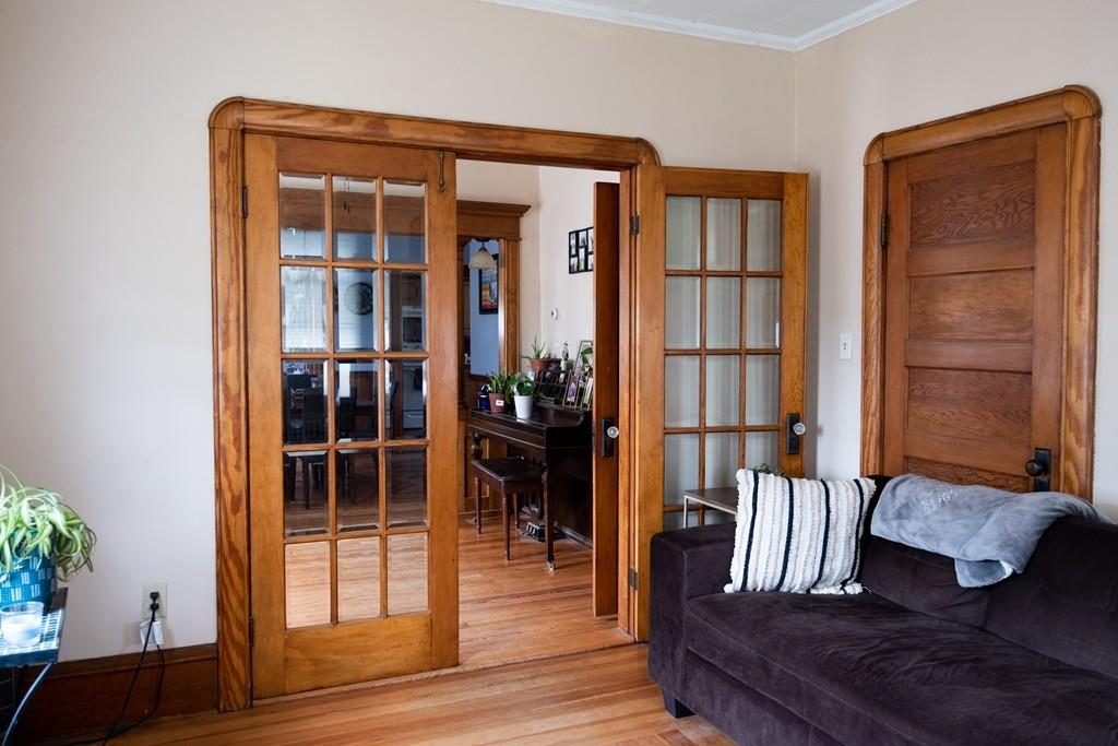 97 Stevens Street Fall River, MA 02721 - Photo 20 of 20 a living room with furniture and wooden floor