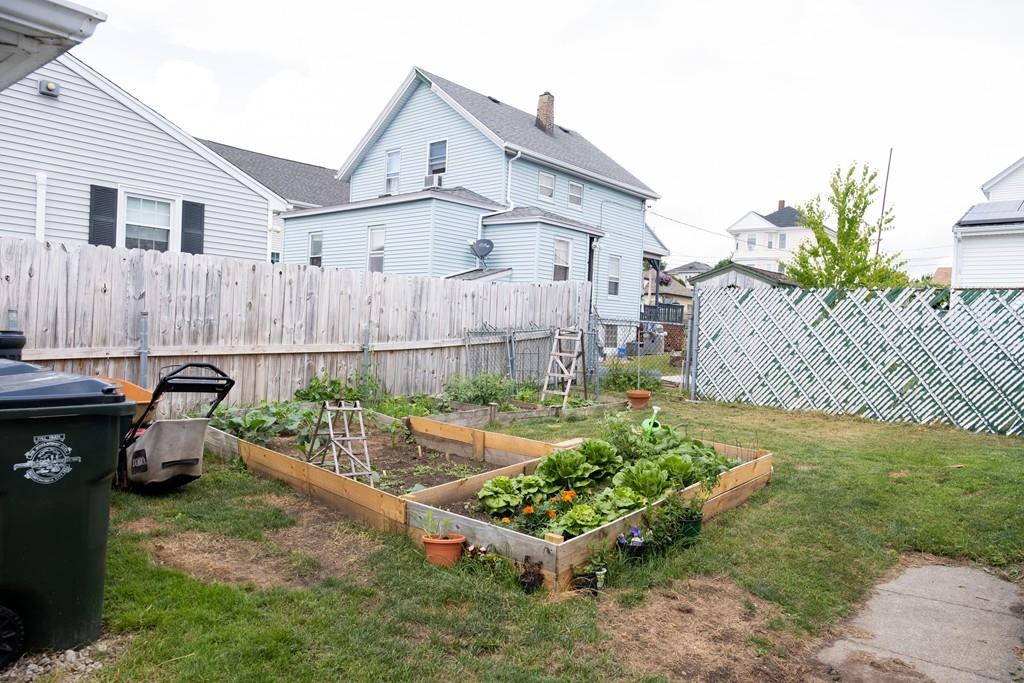 97 Stevens Street Fall River, MA 02721 - Photo 6 of 20 a front view of a house with garden