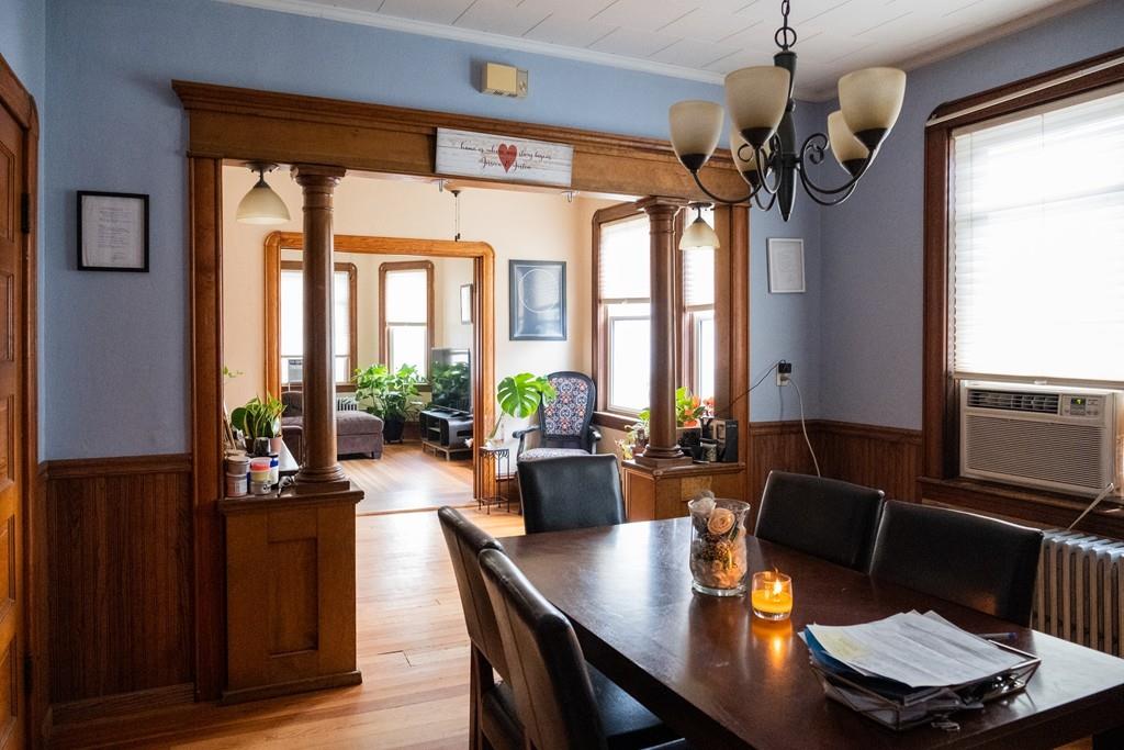 97 Stevens Street Fall River, MA 02721 - Photo 10 of 20 a view of a dining room with furniture a chandelier and large windows
