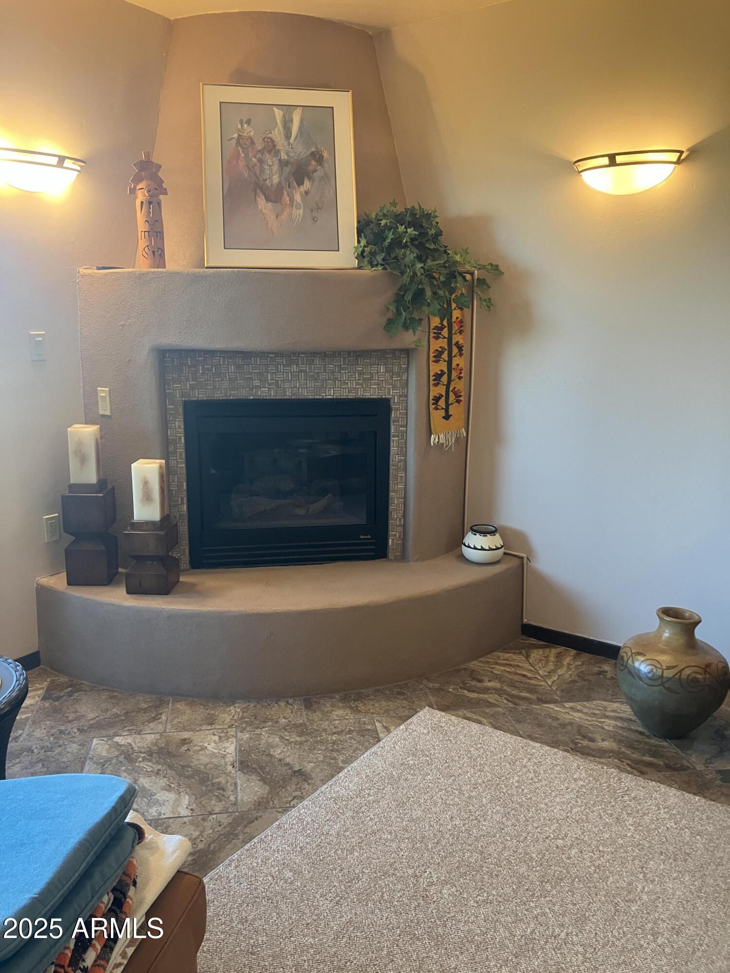 36601 North Mule Train Road, Unit 12C Carefree, AZ 85377 - Photo 14 of 42 a living room with furniture and a fireplace