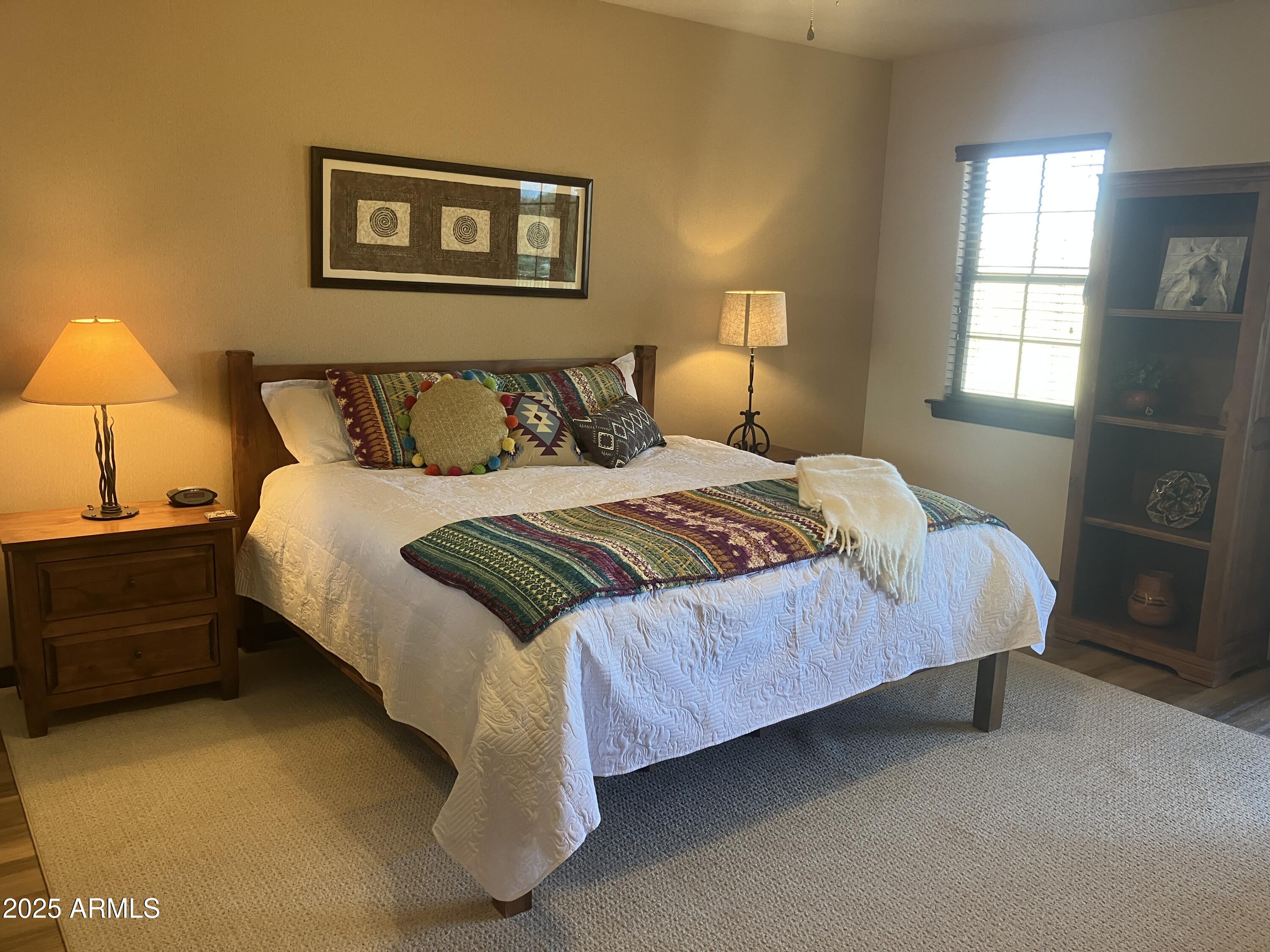 36601 North Mule Train Road, Unit 12C Carefree, AZ 85377 - Photo 20 of 42 a large bed sitting in a bedroom next to a window