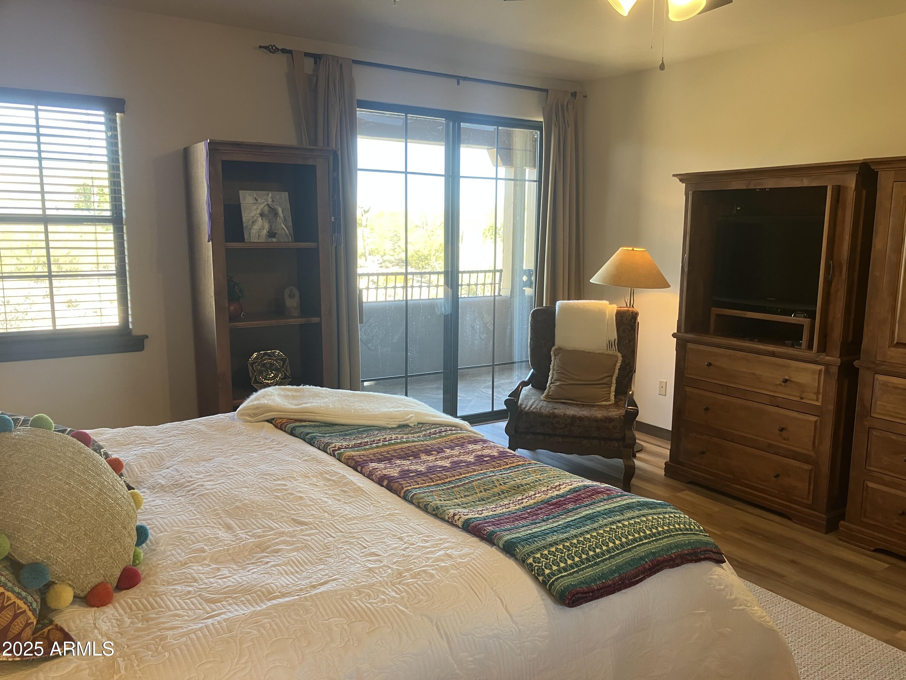 36601 North Mule Train Road, Unit 12C Carefree, AZ 85377 - Photo 21 of 42 a bedroom with a bed and a television