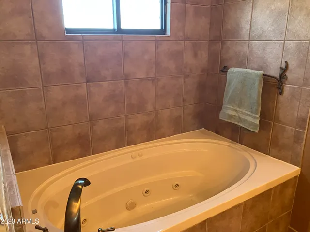 a bedroom with a bed and a cabinets