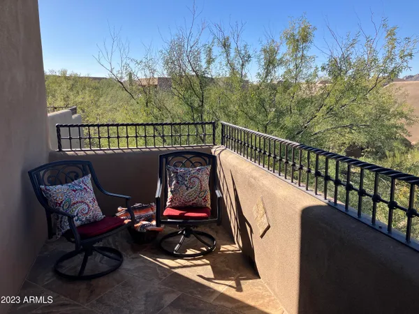 a view of a large building with a mountain in the background