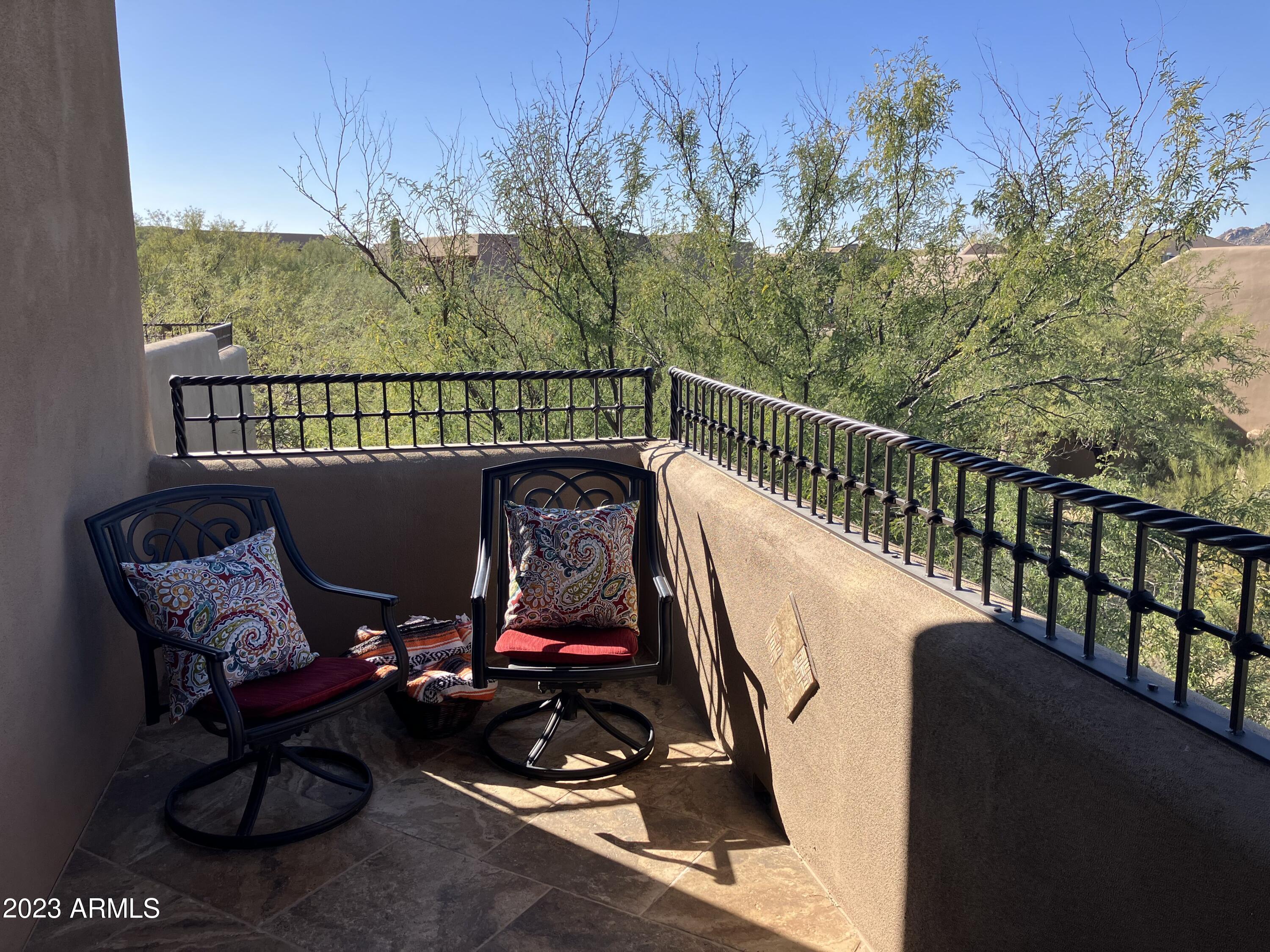 36601 North Mule Train Road, Unit 12C Carefree, AZ 85377 - Photo 30 of 42 a view of a balcony with chairs