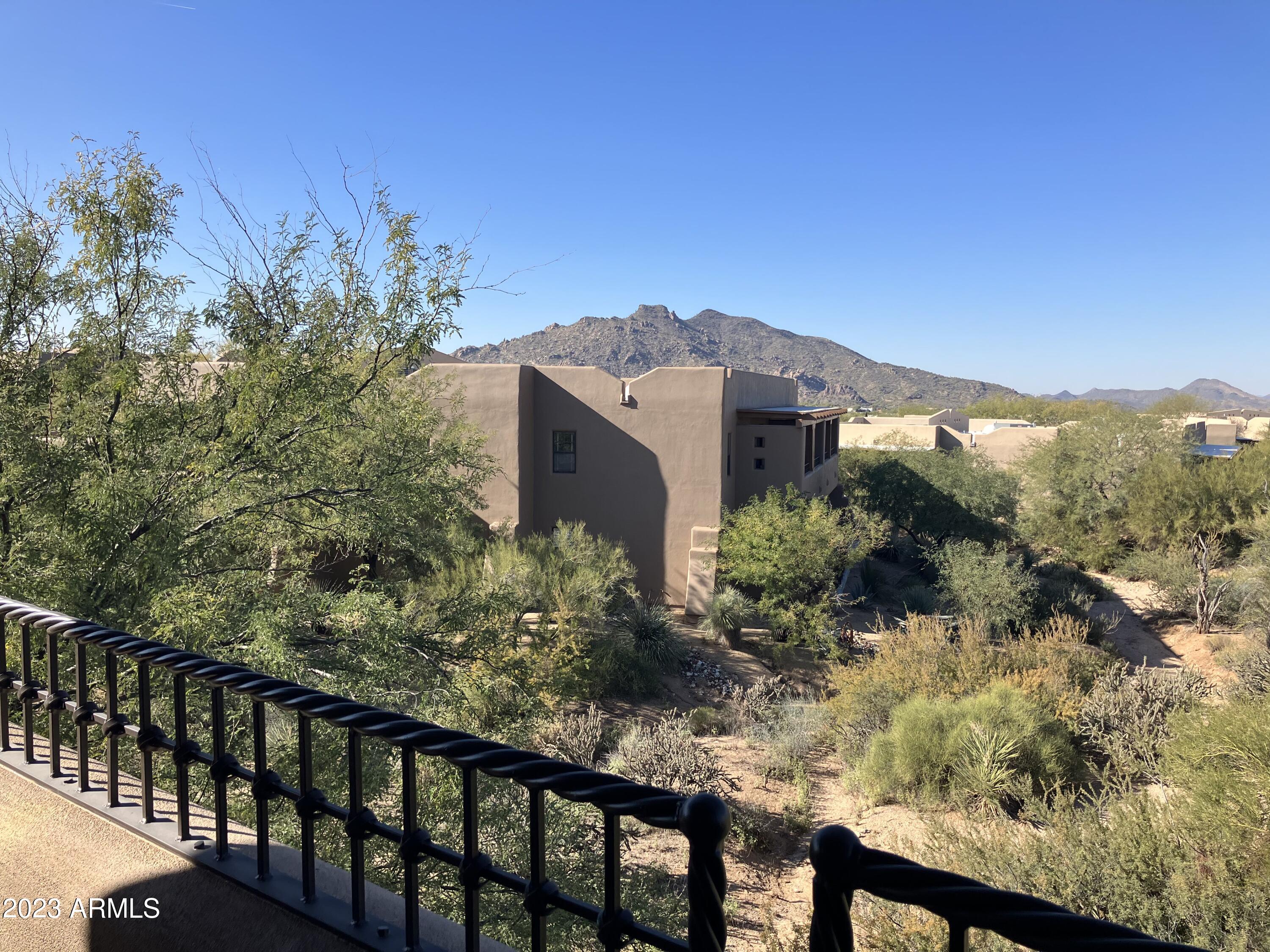 36601 North Mule Train Road, Unit 12C Carefree, AZ 85377 - Photo 31 of 42 a view of a large building with a mountain in the background