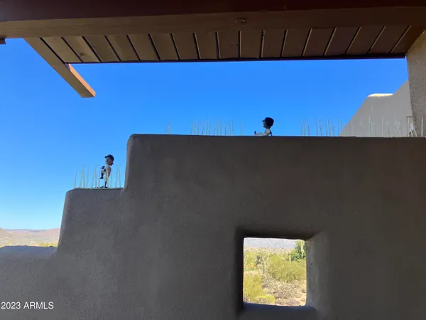 a terrace of a house with outdoor seating