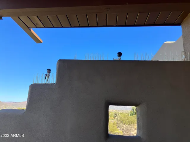 a terrace of a house with outdoor seating