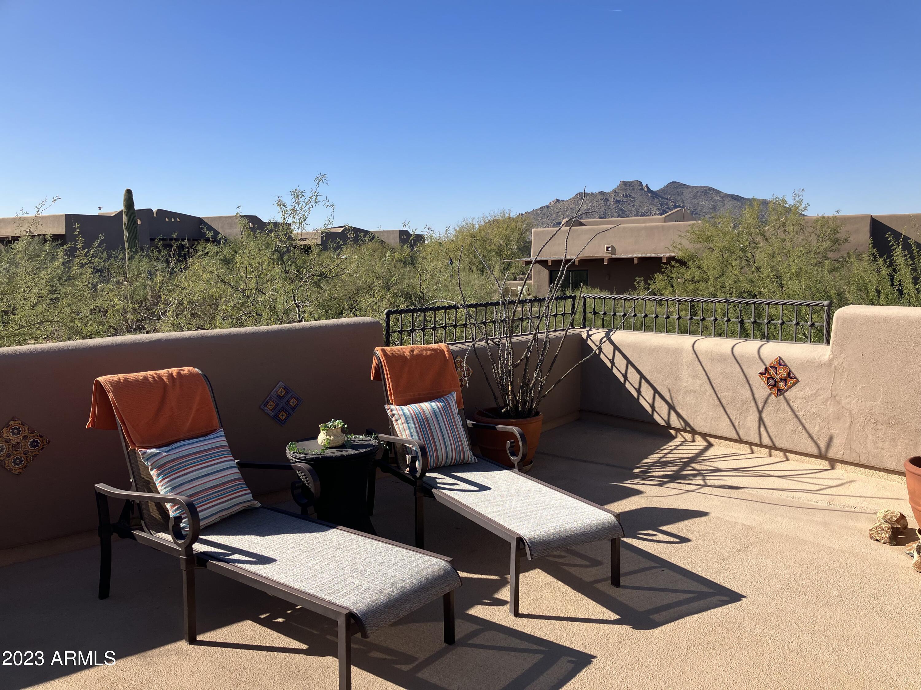 36601 North Mule Train Road, Unit 12C Carefree, AZ 85377 - Photo 37 of 42 a terrace of a house with outdoor seating