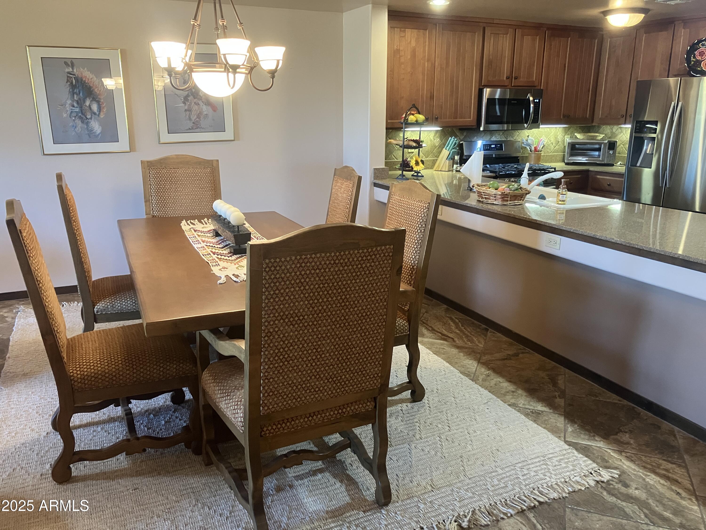 36601 North Mule Train Road, Unit 12C Carefree, AZ 85377 - Photo 7 of 42 a view of a dining room with furniture