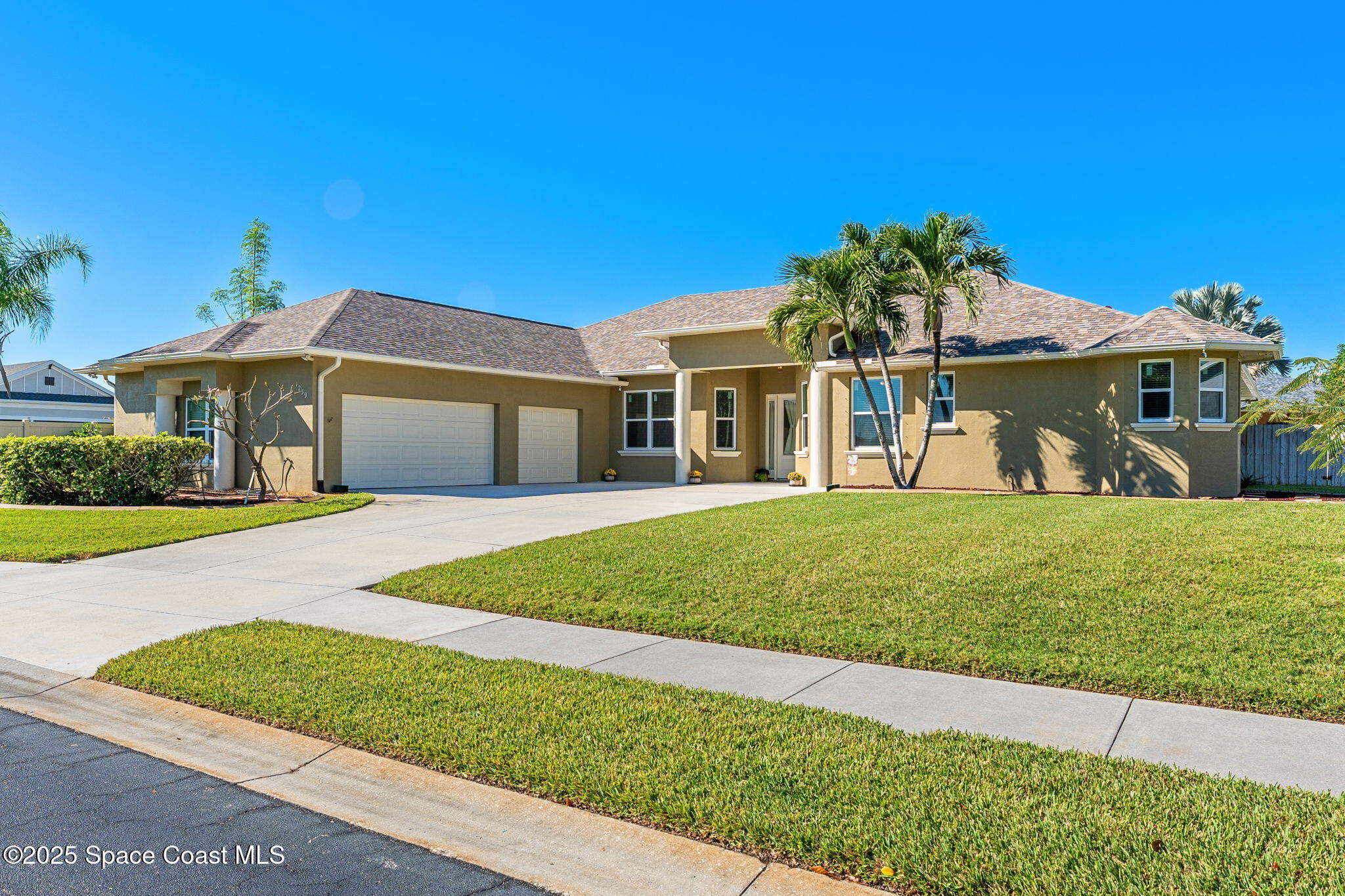 1239 Guy Island Drive Merritt Island, FL 32952 - Photo 2 of 42 a front view of a house with garden