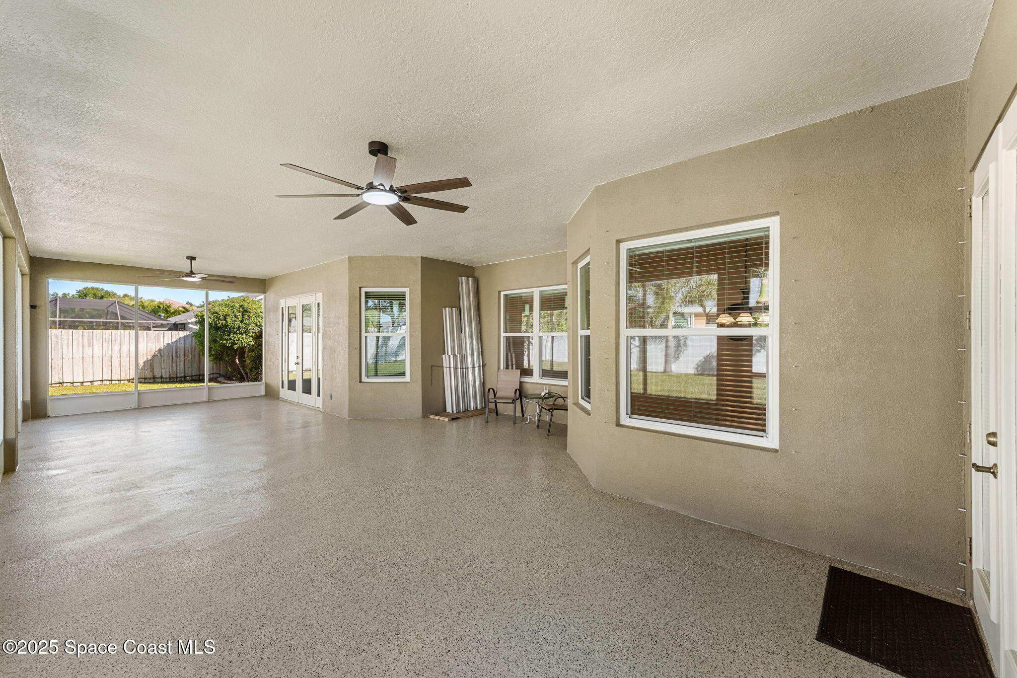 1239 Guy Island Drive Merritt Island, FL 32952 - Photo 28 of 42 a living room with furniture and a large window