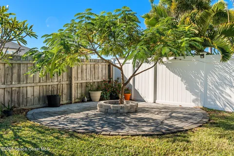 a view of a house with yard and a garden