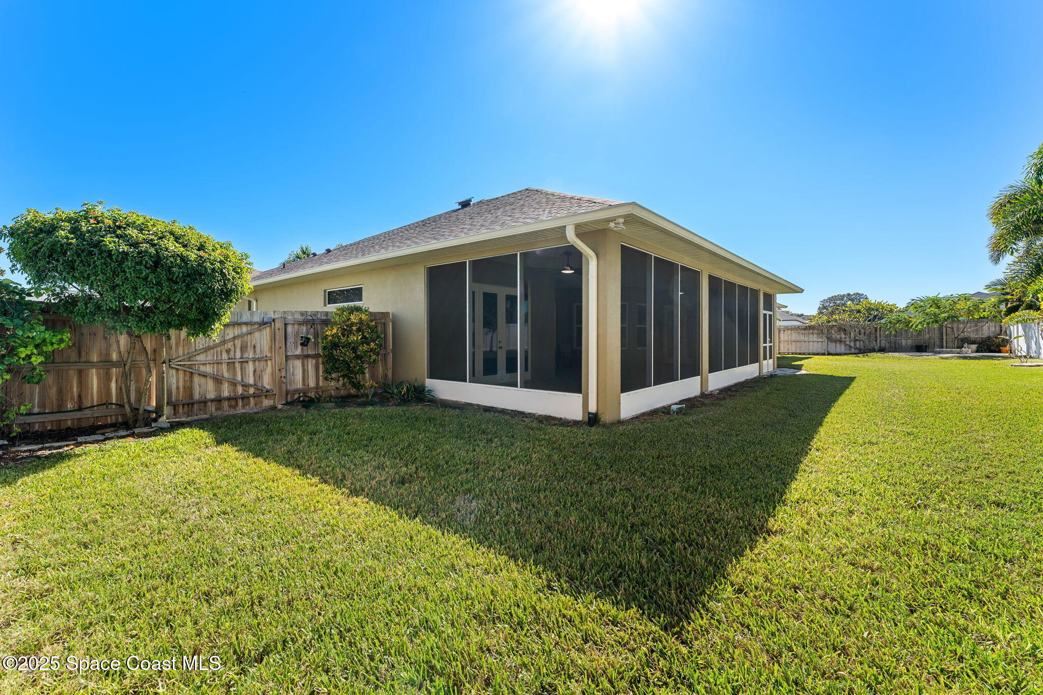 1239 Guy Island Drive Merritt Island, FL 32952 - Photo 32 of 42 a view of a house with yard and a garden