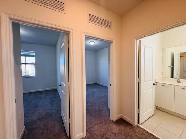 an empty room with closet area