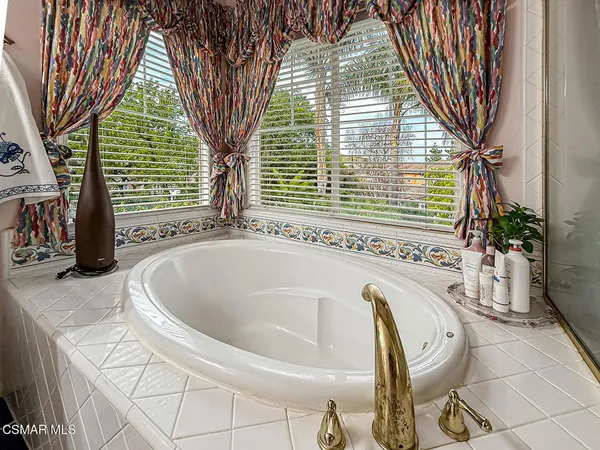 a view of a livingroom with workspace and a window