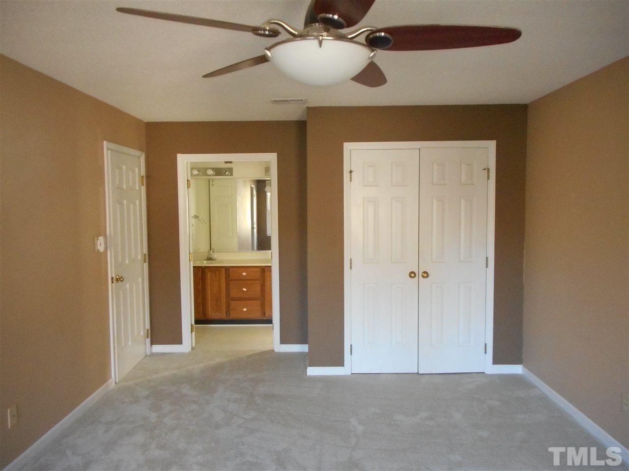 6813 Chasewick Circle Raleigh, NC 27615 - Photo 8 of 24 a view of an empty room and a bathroom