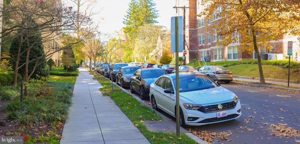 5406 Connecticut Avenue Northwest, Unit 803 Washington, DC 20015 - Photo 19 of 19 a view of a patio with couches and table and chairs with wooden fence