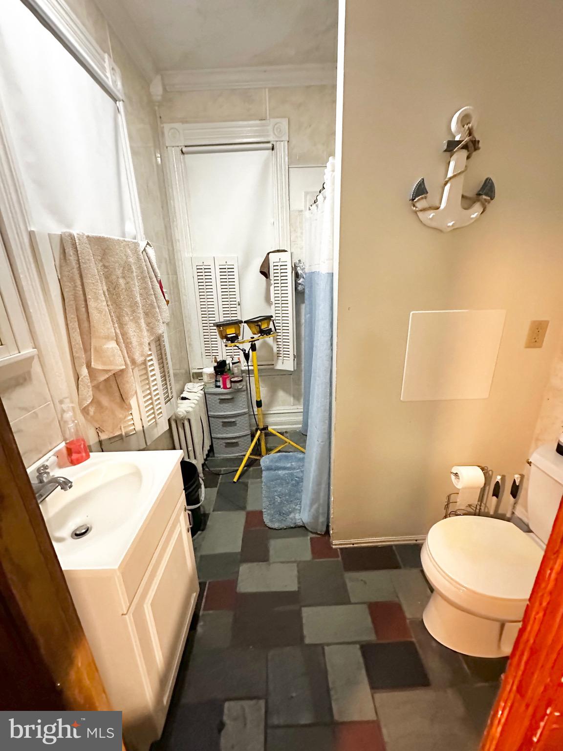 1396 Perkiomen Avenue Reading, PA 19602 - Photo 13 of 45 a bathroom with a sink toilet and shower
