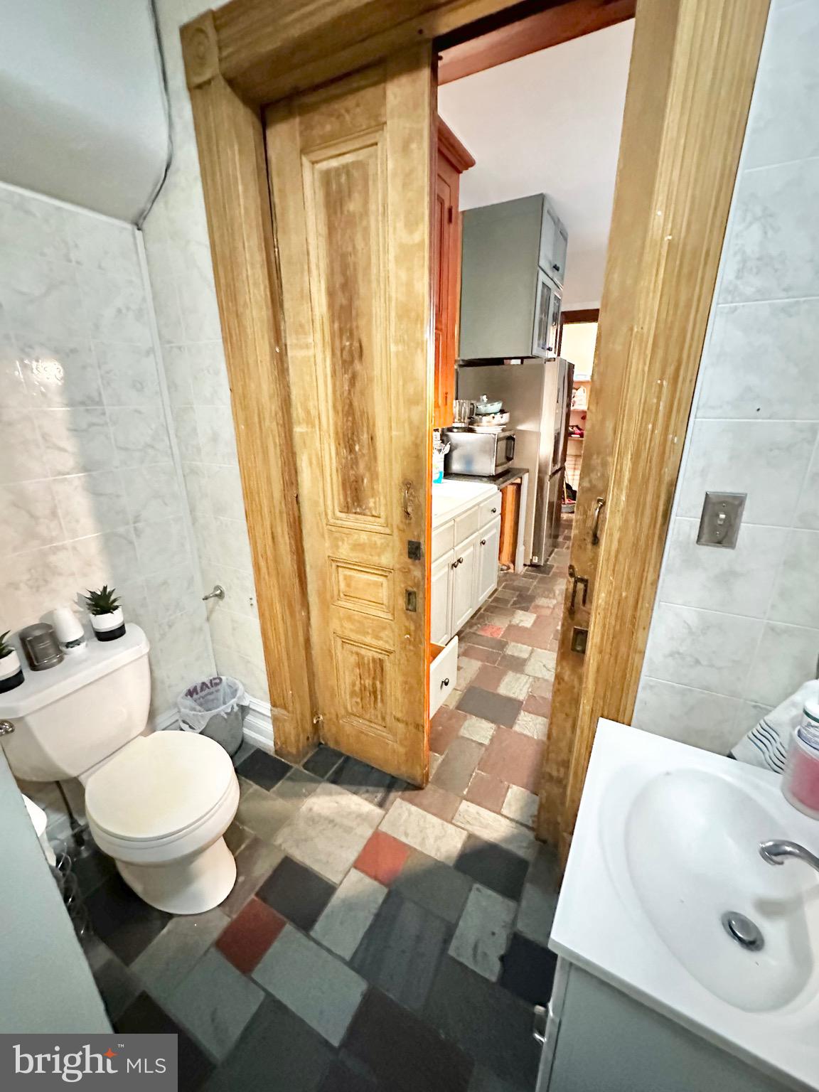 1396 Perkiomen Avenue Reading, PA 19602 - Photo 14 of 45 a bathroom with a sink and a mirror