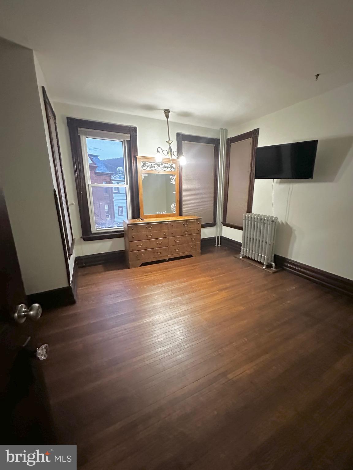1396 Perkiomen Avenue Reading, PA 19602 - Photo 15 of 45 a living room with furniture and a flat screen tv