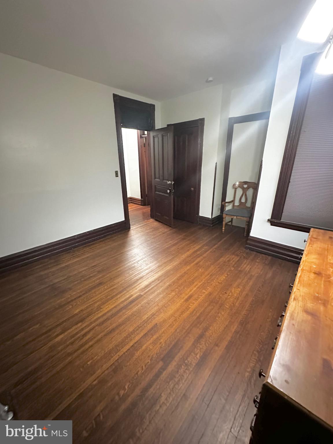 1396 Perkiomen Avenue Reading, PA 19602 - Photo 16 of 45 an empty room with wooden floor and windows