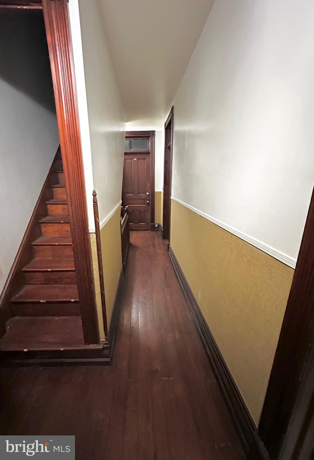 1396 Perkiomen Avenue Reading, PA 19602 - Photo 20 of 45 a view of a hallway with wooden floor and staircase