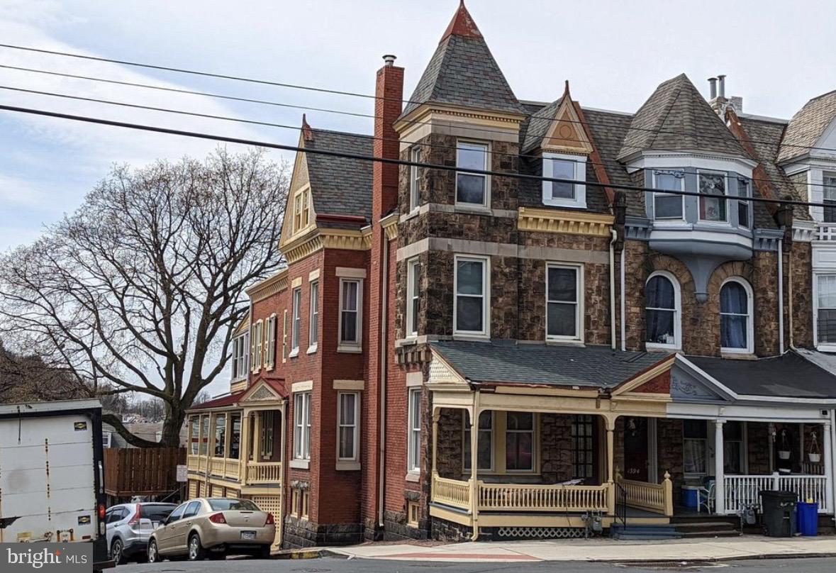 1396 Perkiomen Avenue Reading, PA 19602 - Photo 2 of 45 a front view of a residential apartment building with a yard