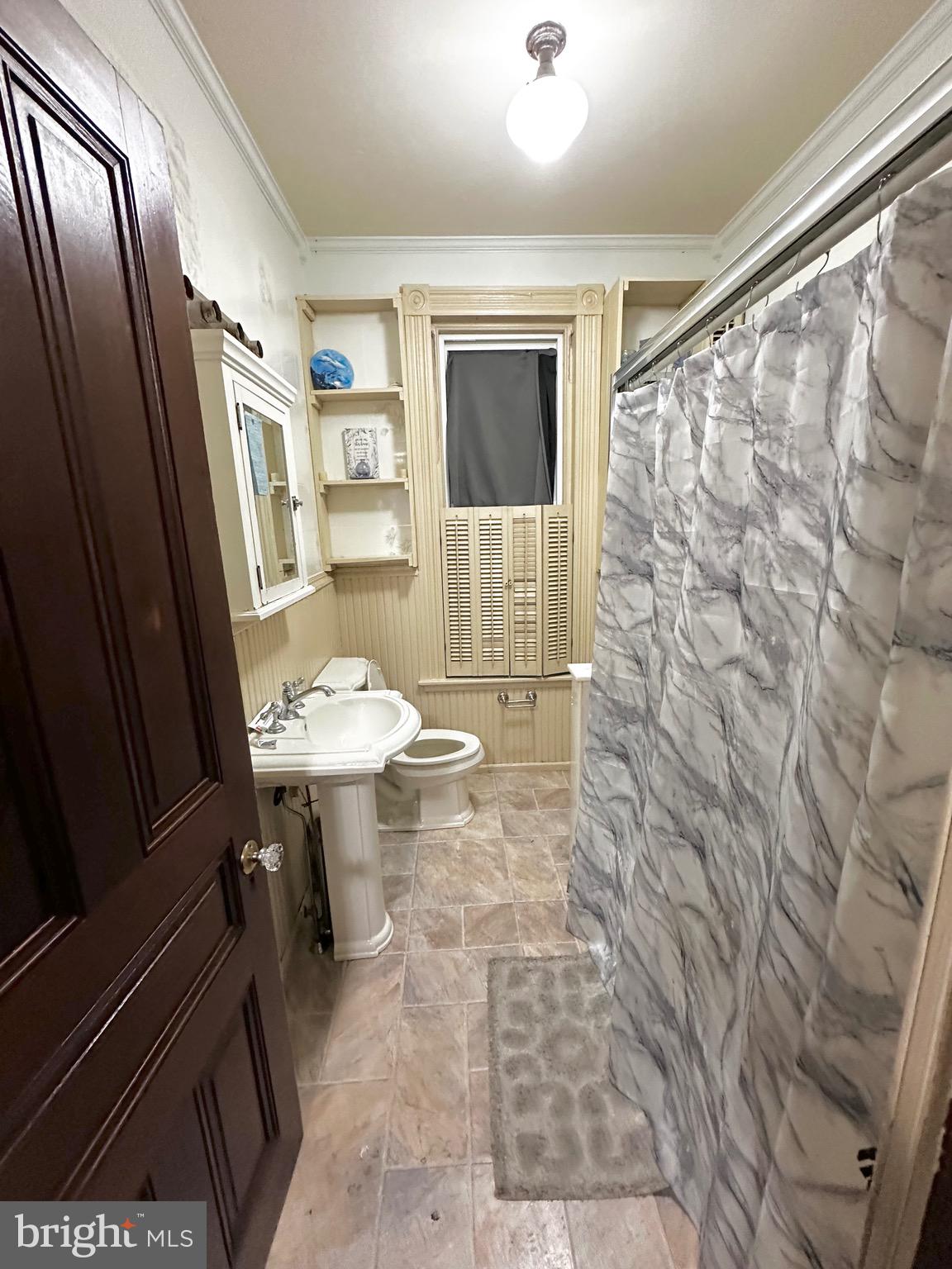 1396 Perkiomen Avenue Reading, PA 19602 - Photo 21 of 45 a bathroom with a sink a mirror and a shower