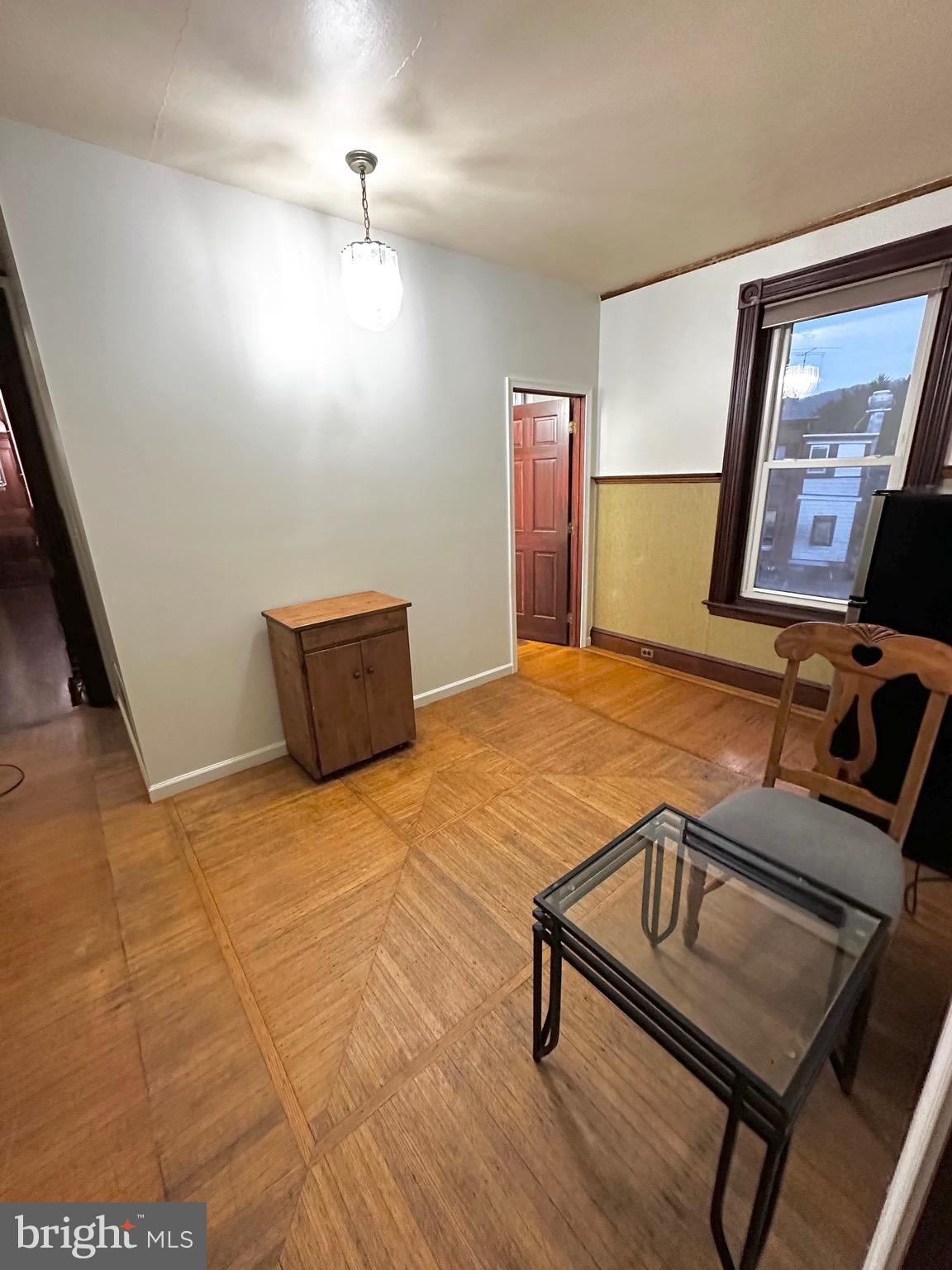 1396 Perkiomen Avenue Reading, PA 19602 - Photo 27 of 45 a bedroom with a bed and wooden floor