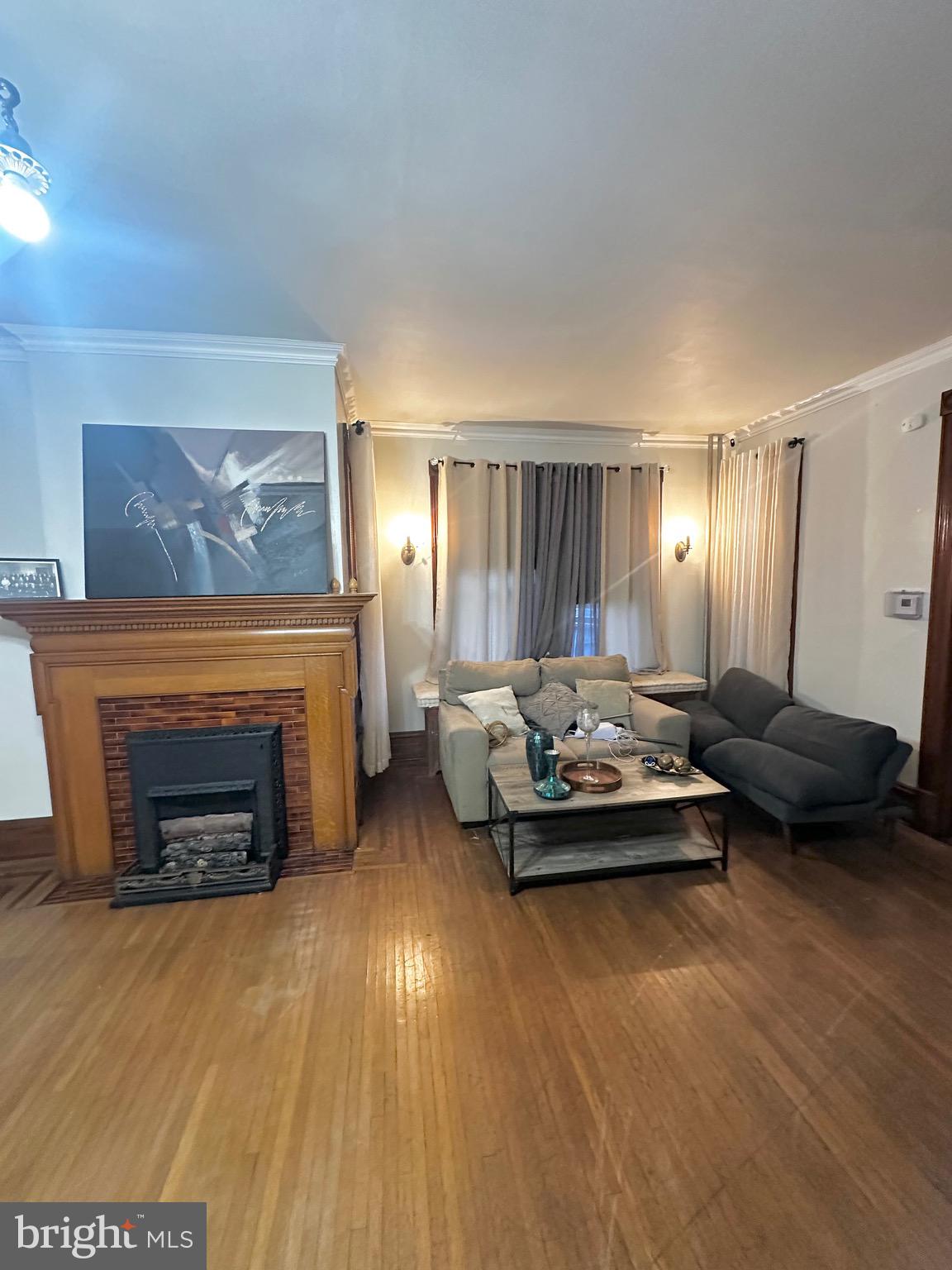 1396 Perkiomen Avenue Reading, PA 19602 - Photo 8 of 45 a living room with furniture and a fireplace