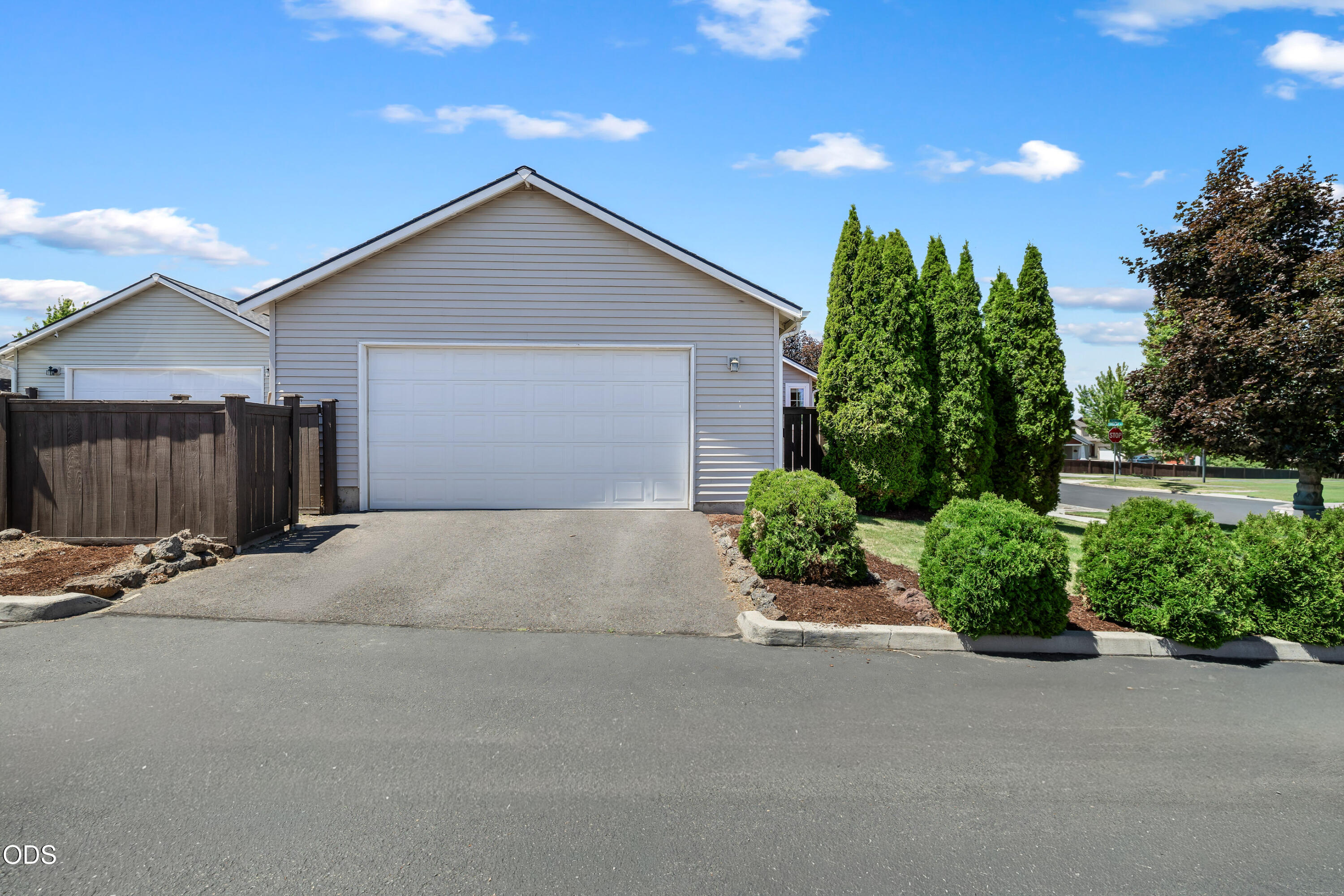 20535 Sunderland Way Bend, OR 97701 - Photo 5 of 41 a front view of a house with a yard and garage