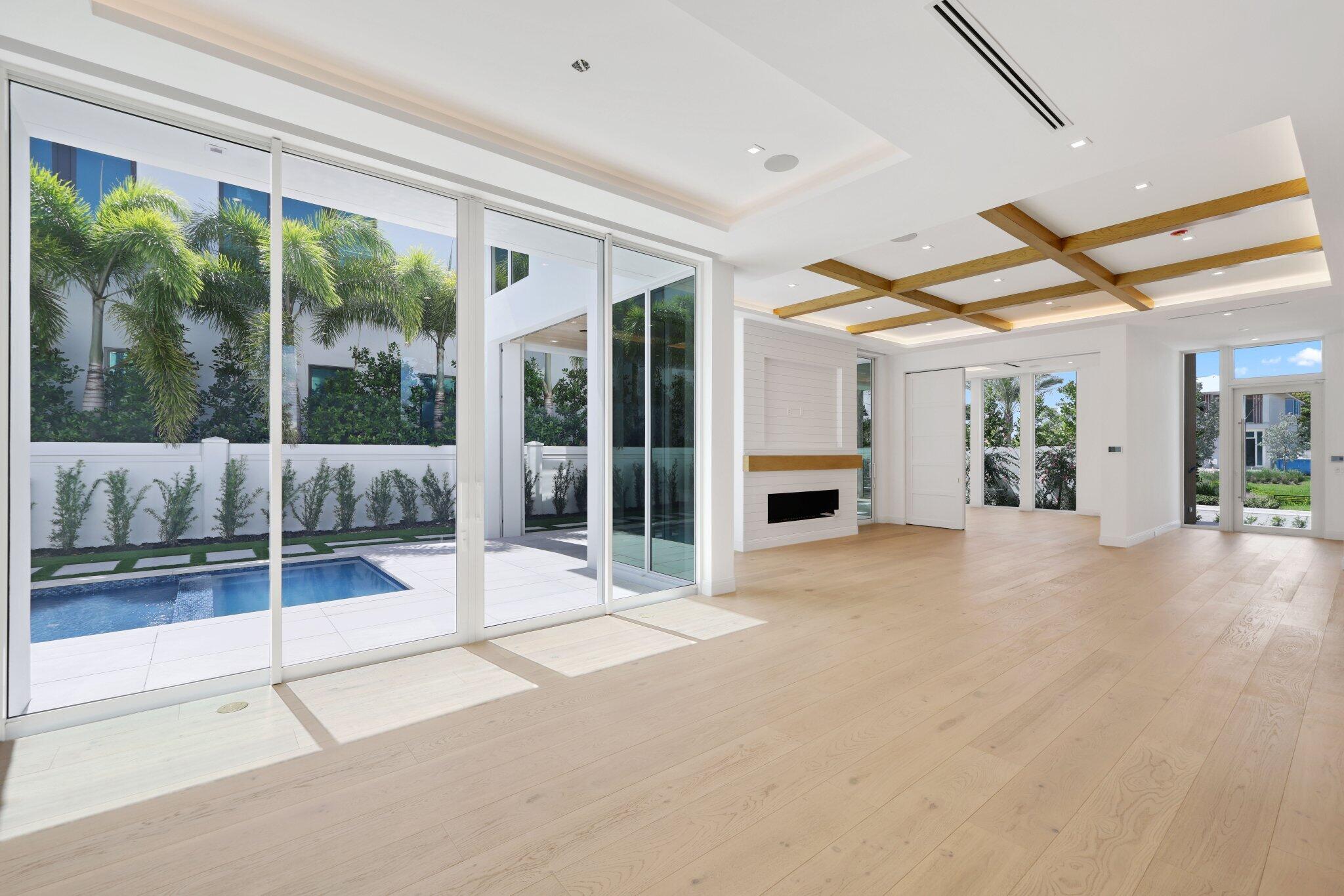 320 Grove Place Delray Beach, FL 33444 - Photo 13 of 85 a view of a hall with floor to ceiling windows and garden