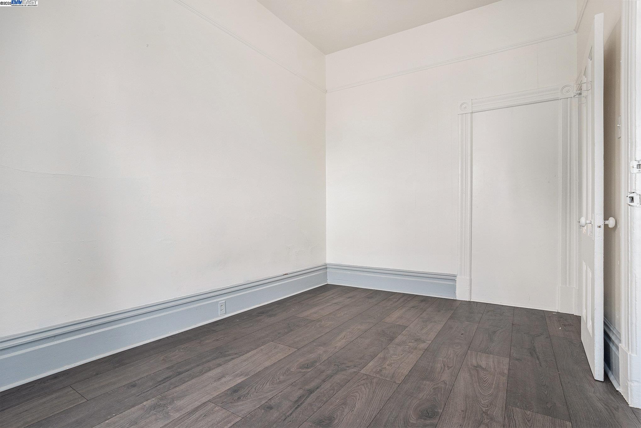 185 7th Street Oakland, CA 94607 - Photo 14 of 20 a view of an empty room with wooden floor