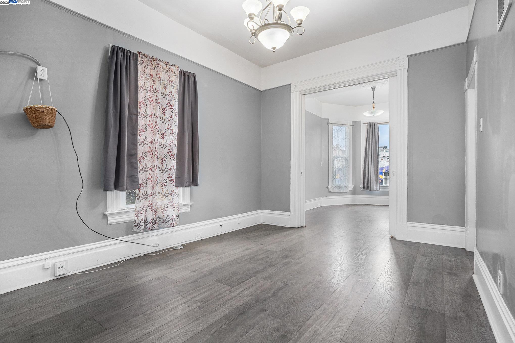 185 7th Street Oakland, CA 94607 - Photo 8 of 20 a view of a livingroom with wooden floor and a large window