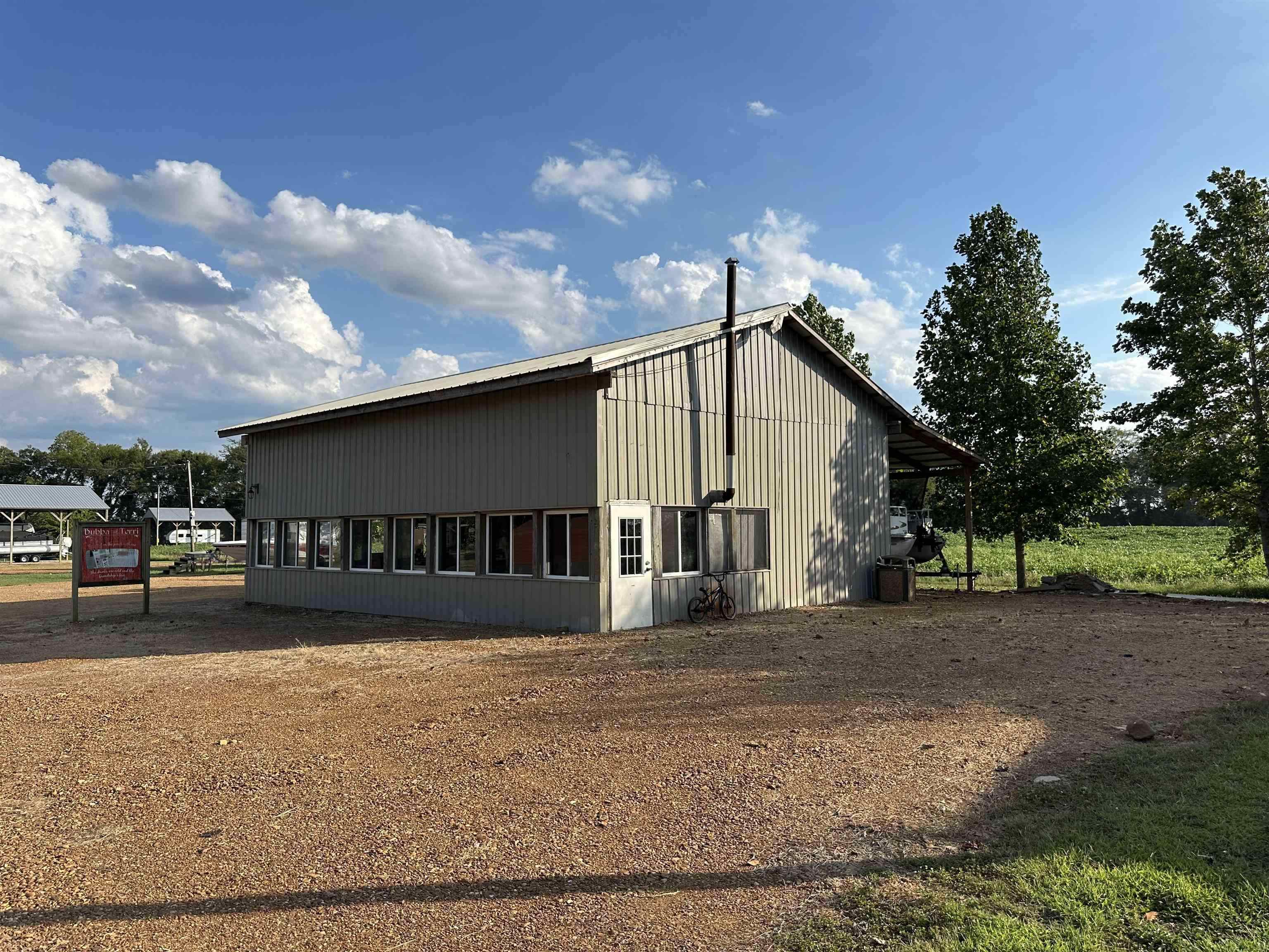 135 Jaycee Lane Adamsville, TN 38310 - Photo 2 of 14 a view of a house with a yard
