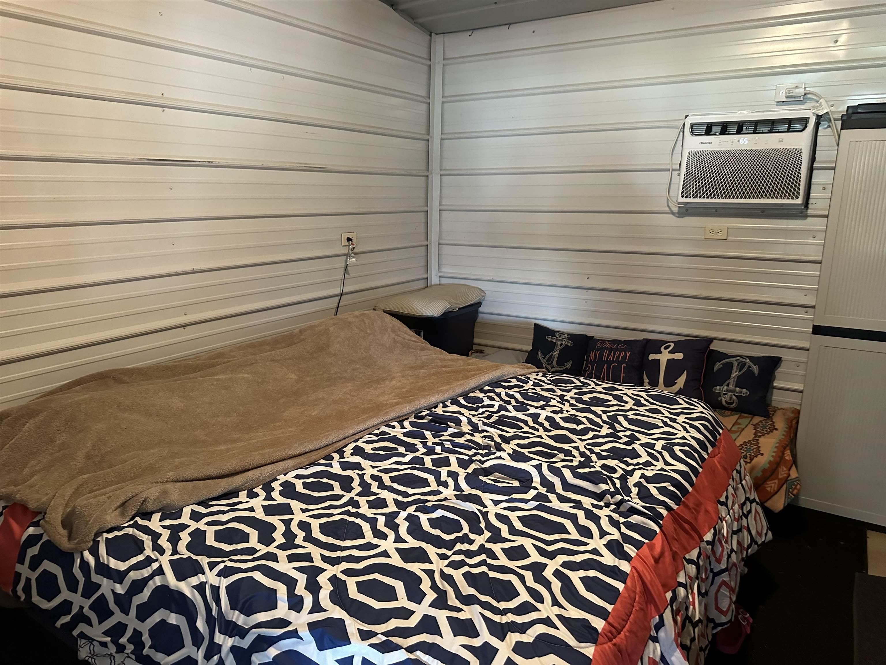 135 Jaycee Lane Adamsville, TN 38310 - Photo 9 of 14 a bathroom with a bathtub and shower