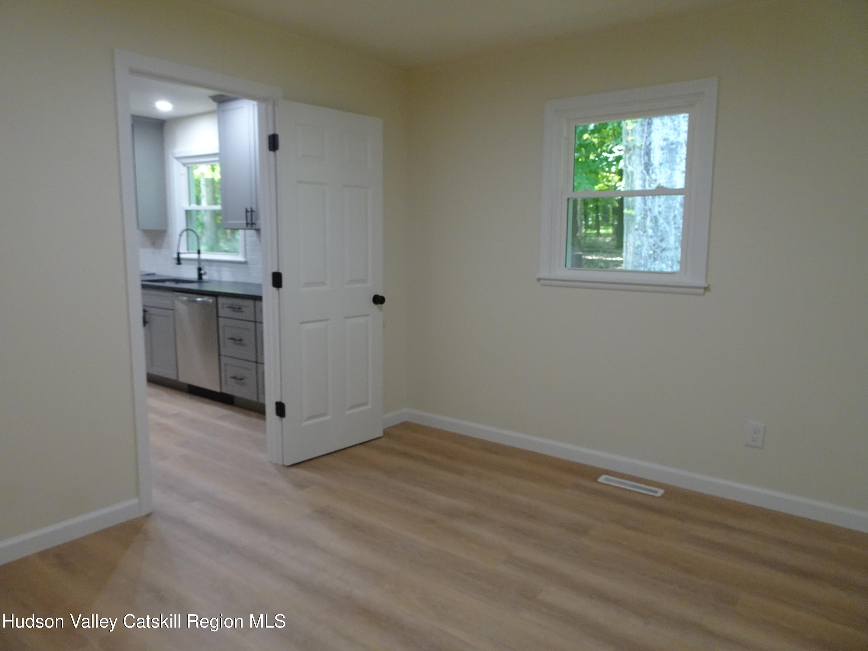 8 Hover Road Claverack-Red Mills, NY 12513 - Photo 17 of 33 an empty room with wooden floor and windows