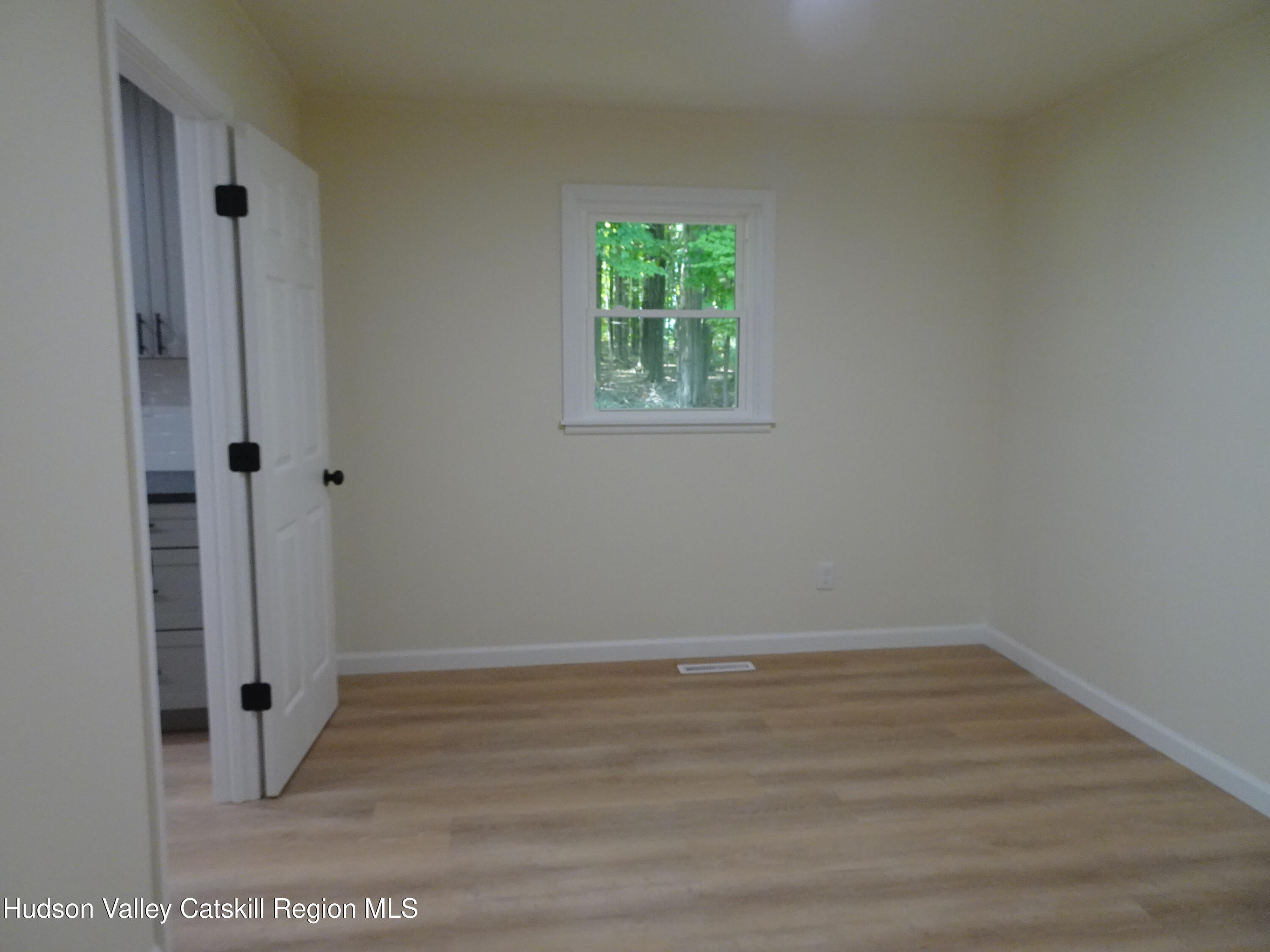 8 Hover Road Claverack-Red Mills, NY 12513 - Photo 18 of 33 an empty room with wooden floor and window