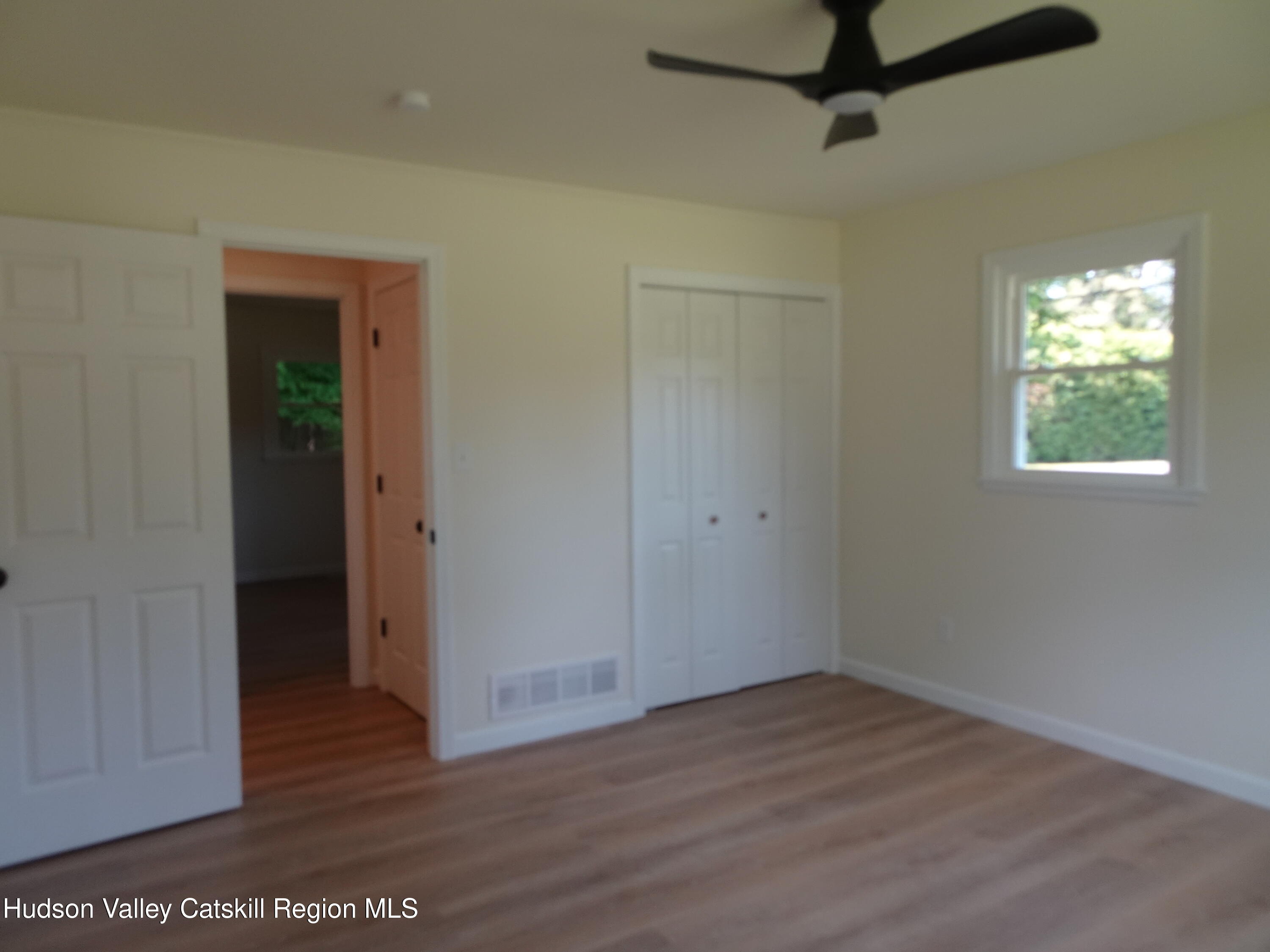 8 Hover Road Claverack-Red Mills, NY 12513 - Photo 26 of 33 a view of hallway with window and wooden floor
