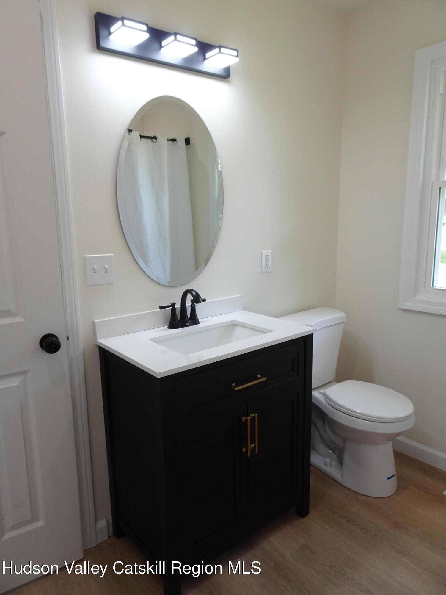 8 Hover Road Claverack-Red Mills, NY 12513 - Photo 27 of 33 a bathroom with a sink vanity and a mirror